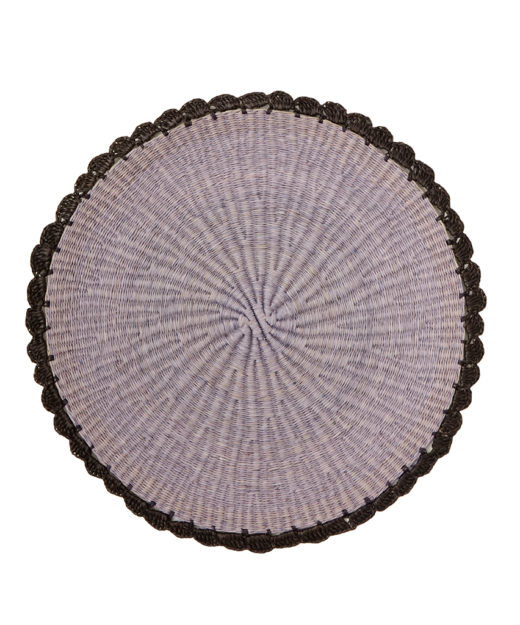 Round straw placemat with scalloped edges