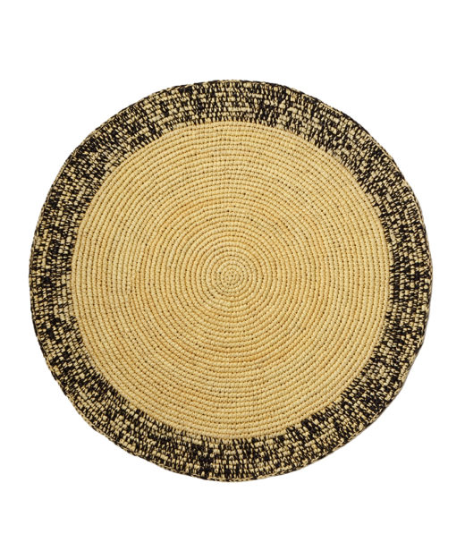 Straw placemat with black speckles
