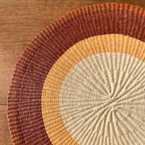 Straw placemat with stripes